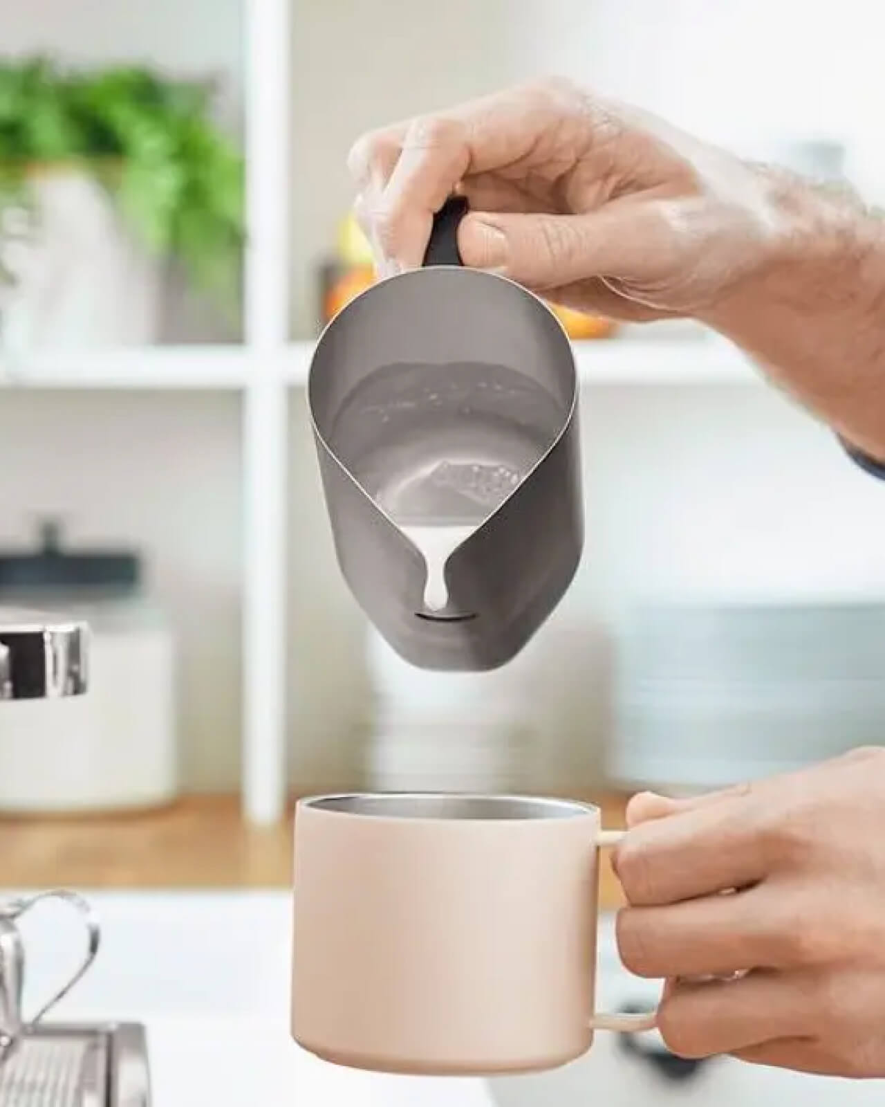 Making a latte at home with frothed milk from the Equator MiiR Milk Pitcher | Equator Coffees